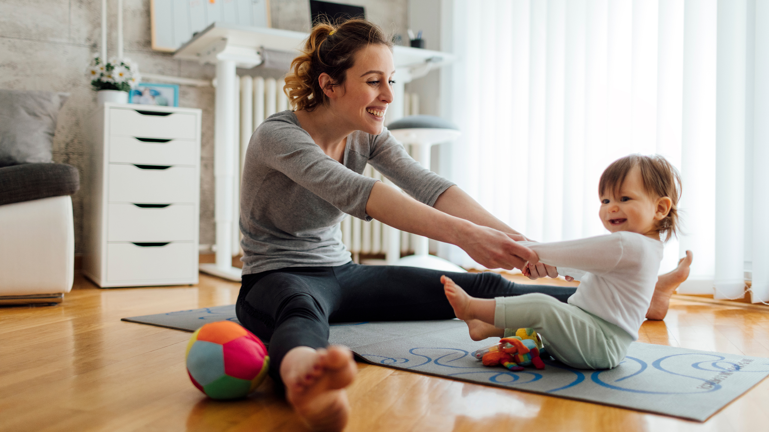 Parent exercising at home with children